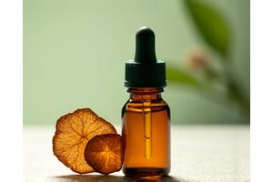 Small amber bottle of adaptogen tincture with a dropper.
